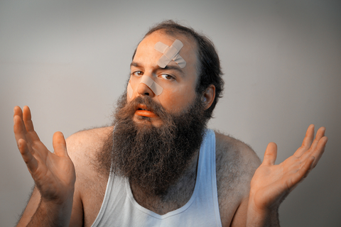 http://www.dreamstime.com/stock-photography-bandaged-bearded-sad-man-shrugs-his-hands-confusion-image41966882